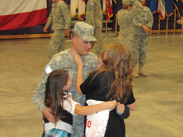Then-Chief Warrant Officer 3 Chris Westbrook returns to Fort Riley, Kansas, and his family after a yearlong deployment to Iraq in 2010.  
