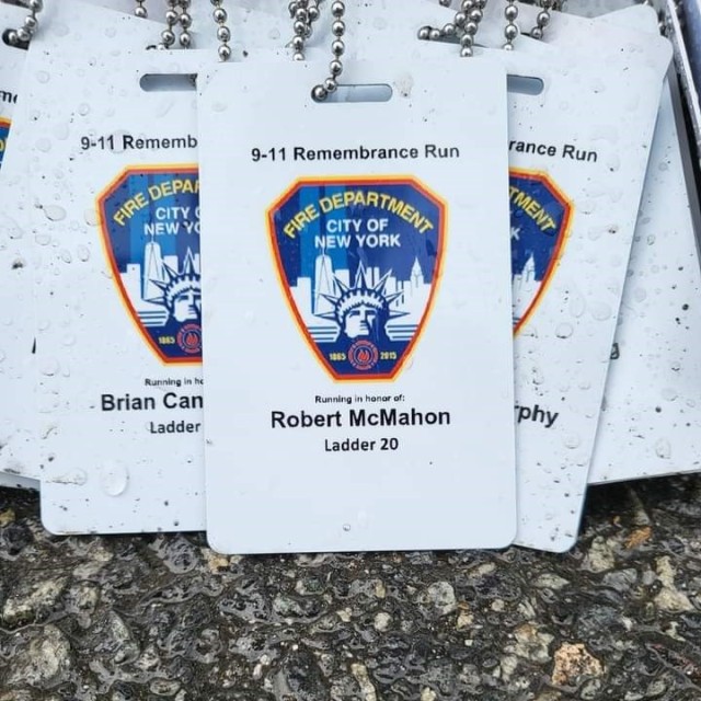 Robert D. McMahon&#39;s name tag rests near a monument following a 9/11 remembrance ceremony at Camp Walker, Republic of Korea, September 12, 2022. The remembrance ceremony concluded with a 2-mile run in memory of firefighters killed by the 9/11 terrorist attacks. Runners wore nametags of the individual firefighters lost to honor their sacrifice, including McMahon.