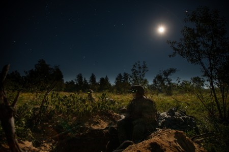 Infantry Soldiers assigned to 1st Battalion, 148th Infantry Regiment man their foxholes before force-on-force operations during Operation Northern Strike at Camp Grayling, Mich., Aug. 15, 2022. Infantry brigade combat teams must train in a joint, multicomponent, multinational environment to ensure they can fight and win in an expeditionary environment against a near peer adversary.