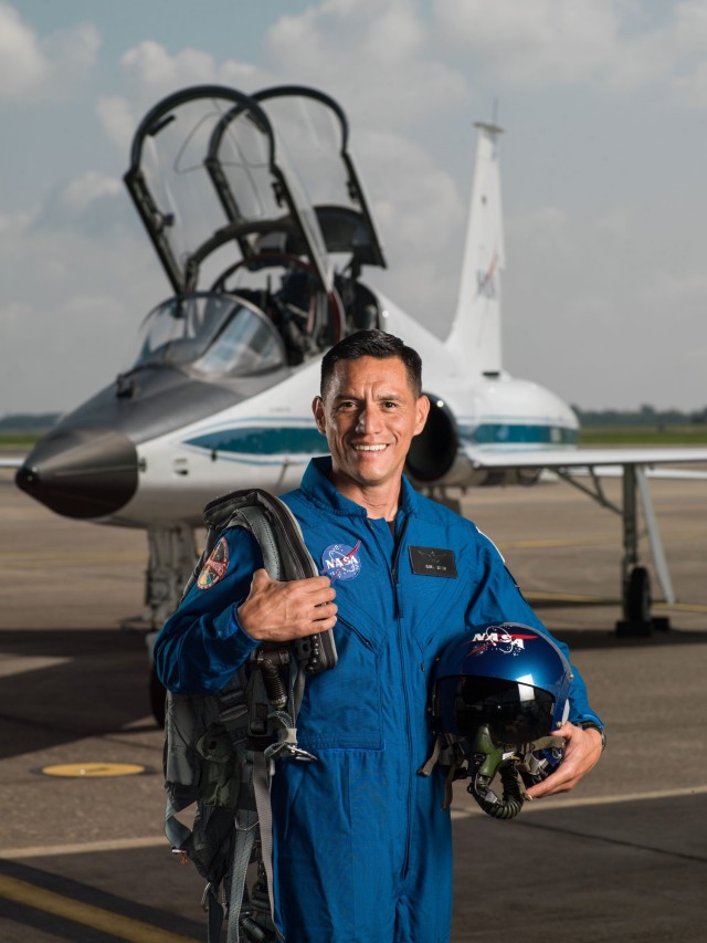 Lt. Col. Frank Rubio poses for an official NASA photo in front of a T-38. Basic astronaut mission specialists must record four hours a month, and mission commanders and pilots must record 15 hours a month piloting a T-38.