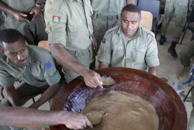 Members of the 3rd Battalion, Fiji Infantry Regiment mix and hand out ceremonial Kava during the Kava Ceremony to kick off Exercise Cartwheel 2022 at Black Rock Camp, Fiji. Exercise Cartwheel provides tough, realistic training, strengthening RFMF and U.S. Army capacity as regional leaders, increasing security cooperation for a free and open Indo-Pacific. (U.S. Army photo by Sgt. 1st Class Andrew Guffey 343rd Mobile Public Affairs Detachment)