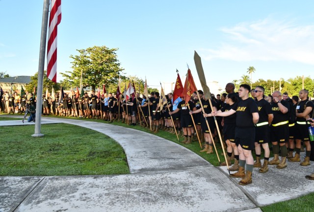 Approximately 1,500 Soldiers from the 166th RSG Brigade, and other service members, stand at attention before commencement of the Fort Buchanan Garrison's tribute ceremonies in remembrance of 9/11 conducted September 11, 2022 at the...