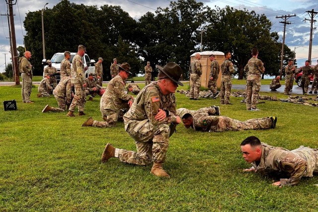 Competitors complete hand-release push ups following a three-mile run Saturday.