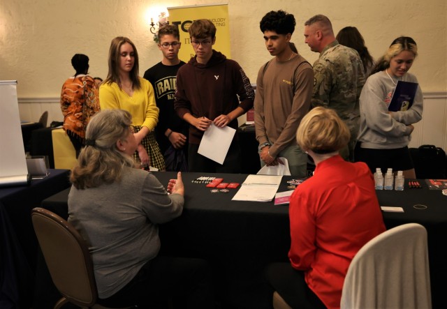 Attendees of the Fort Knox Career & Education Fair Sep. 15, 2022 speak with representatives from one of the more than 100 education institutions and employers at the event.