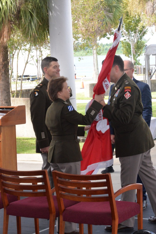 Outgoing New Orleans District commander Col. Stephen Murphy passes the colors to Mississippi Valley Division commander Maj. Gen. Diana Holland on Sept. 16, 2022.