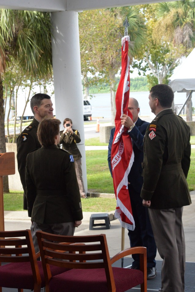 New Orleans District deputy engineer Mark Wingate prepares to pass the colors to outgoing New Orleans District commander Col. Stephen Murphy on Sept. 16, 2022.