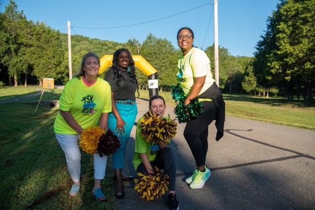 Natalie Taylor, Neila Lawrence, Olivia Pierce and Wanda Gilbert cheer for the finishers. 