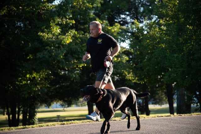 Scott Bodine runs with his dog, Stone. 