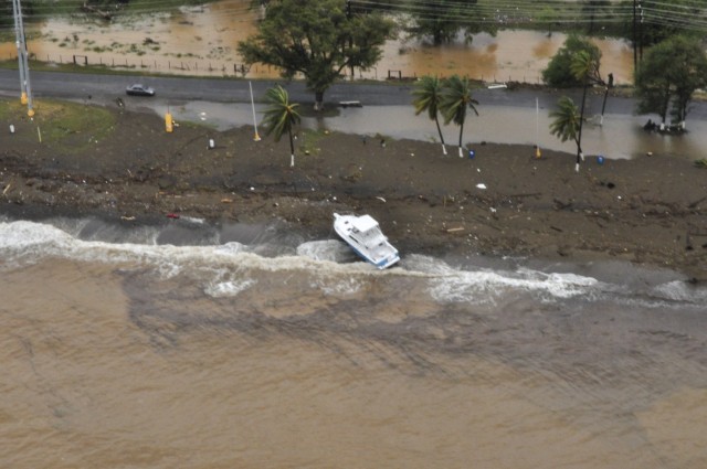 An aircrew from Coast Guard Air Station Borinquen conduct an overflight of Puerto Rico in the aftermath of Hurricane Fiona. The Coast Guard is using flights like this to assess safe port conditions and pollution concerns left in the wake of the storm.