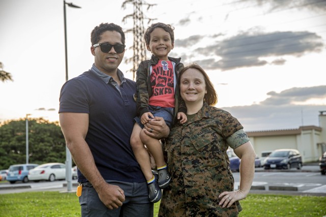 Nicholas White, left, a Marine Corps veteran and Semper Fit complex manager, and Staff Sgt. Felicia White, the custodian of postal effects at the Marine Corps Air Station Futenma Post Office, pose with their son, Nicky, on Camp Foster, Okinawa, Japan, April 4, 2022. Month of the Military Child, celebrated annually in April, recognizes military families and their children for the daily sacrifices and unique challenges they overcome.