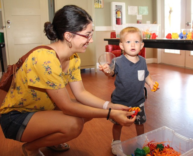 A family plays with sensory toys at the Army Community Service Sensory Gala July 22, 2022 at the New Parent Support Program Building on Fort Rucker. Photo by Jay Mann.