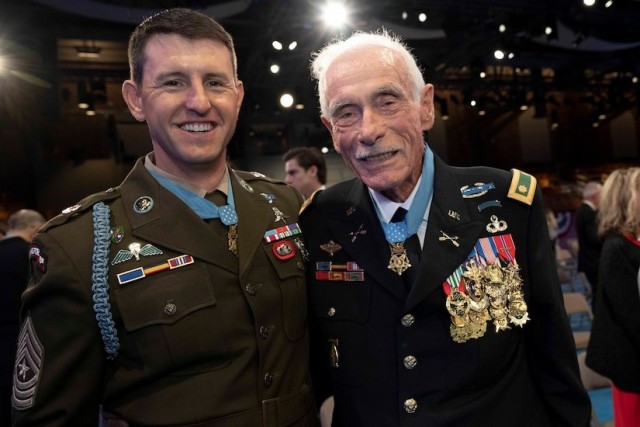 Medal of Honor recipients Army Sgt. Maj. Thomas P. Payne, left, and retired Army Maj. John J. Duffy pose for a photo after the ceremony inducting them into the Pentagon Hall of Heroes at Joint Base Myer-Henderson Hall, Va., July 6, 2022.