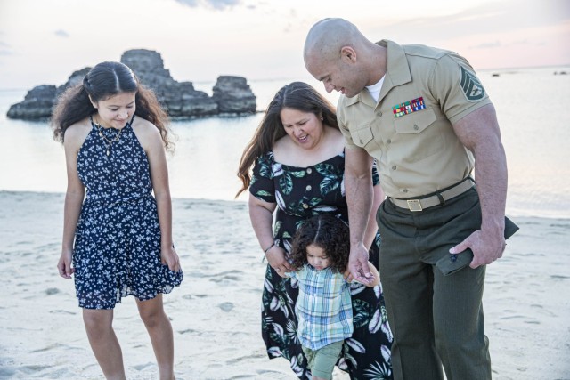 U.S. Marine Corps Staff Sgt. Victor Quezada, the aviation supply and preventative maintenance inspection supply staff noncommissioned officer in charge with Marine Aviation Logistics Squadron 36, 1st Marine Aircraft Wing, spends time with his family in Chatan, Okinawa, Japan, April 6, 2022. Month of the Military Child, celebrated annually in April, recognizes military families and their children for the daily sacrifices and unique challenges they overcome.