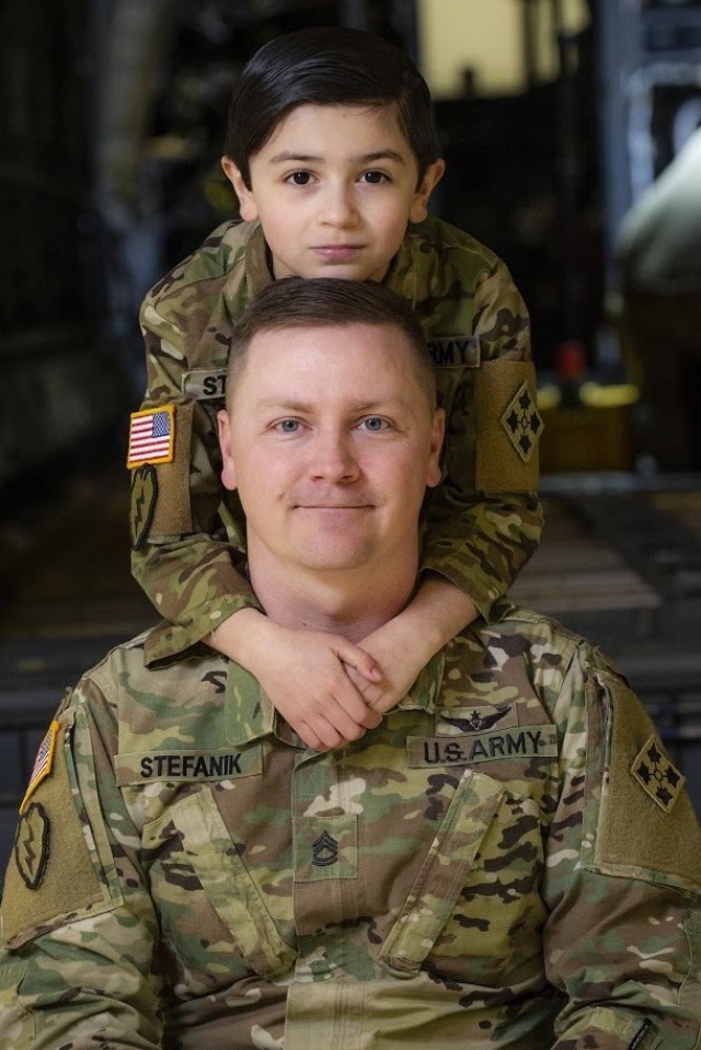 Sgt. 1st Class John Stefanik, a UH-60 Black Hawk helicopter repairer assigned to 404th Aviation Support Battalion, 4th Combat Aviation Brigade, 4th Infantry Division, poses with his son, Aiden, April 6, 2022, at Fort Carson, Colorado. Aiden is just one of many military children that helps to support the Army through the support he gives his family.