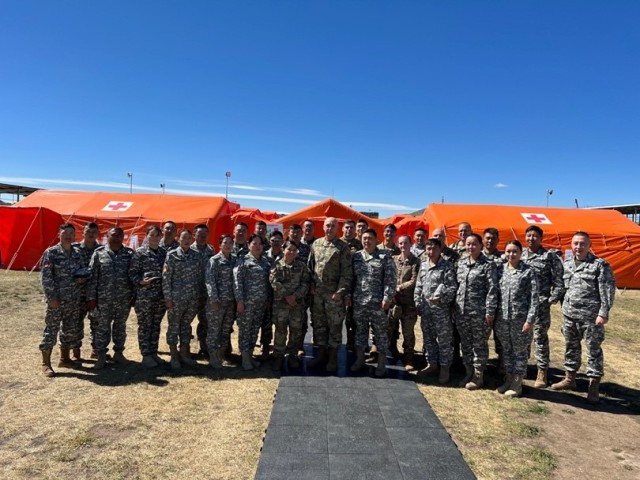U.S. Medical Field Training Exercise delegation (including 8th FRSD) with
NEMA counterparts at the exercise site. (Courtesy photo by U.S. Army Soldier)
