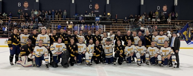 Navy sinks Army on ice in overtime