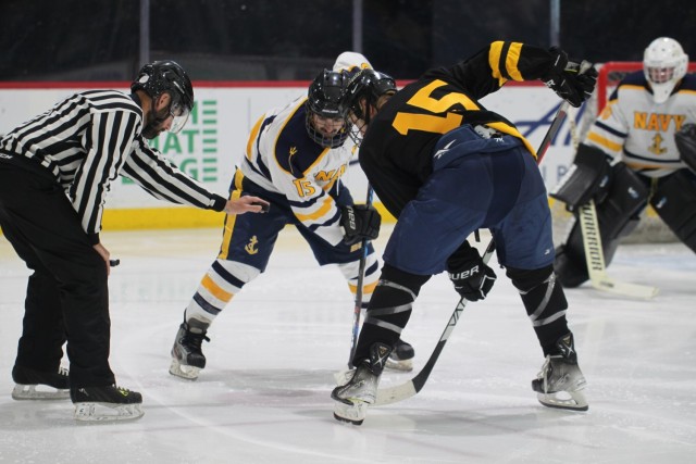 Navy sinks Army on ice in overtime