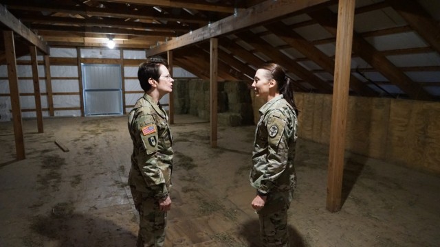 Veterinary Corps Chief Col. Deborah Whitmer and Master Sgt. Tonya Mullin, animal care technician and operations noncommissioned officer in charge at Public Health Command Europe, discussing a stale they recently visited.
