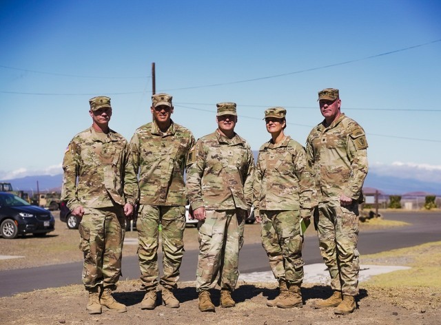 Senior Leaders of the 9th Mission Support Command (MSC) pose for a photo during the rapid home mobilization rehearsal at Pohakuloa Training Area (PTA) on the Big Island of Hawaii. Pictured is 3301st Mobilization Support Battalion (MSB) Command Sgt. Maj. Ryan Booher (far left), 3301st MSB Lt. Col. Tyson Voelkel (Middle Left), 9th MSC Commander, Brig. Gen. Mark Siekman (middle), 3rd Mission Support Group (MSG) Commander Abigail Cathelineaud (middle right), and 100th Battalion 442nd Infantry Regiment Commander Lt. Col. Alan Perkins (far right).

Photo by Sgt. Adrianne Tuante