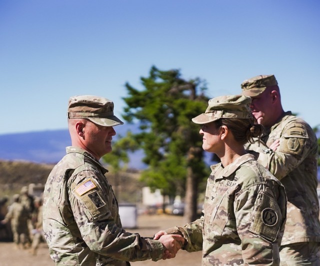 The 9th Mission Support Command (MSC) Commander Brig. Gen. Mark Siekman shakes hands with 3rd Mobilization Support Group Commander Col. Abigail Cathelineaud during the rapid home mobilization rehearsal at Pohakuloa Training Area (PTA) on the Big Island of Hawaii. 9th MSC Commander, Brig. Gen. Mark Siekman paid a visit to PTA, to oversee the proceedings of the rehearsal, which was designed to prepare Soldiers for mobilization, using Soldiers from the 3301st Mobilization Support Battalion (MSB) and other support staff.

Photo by Sgt. Adrianne Tuante