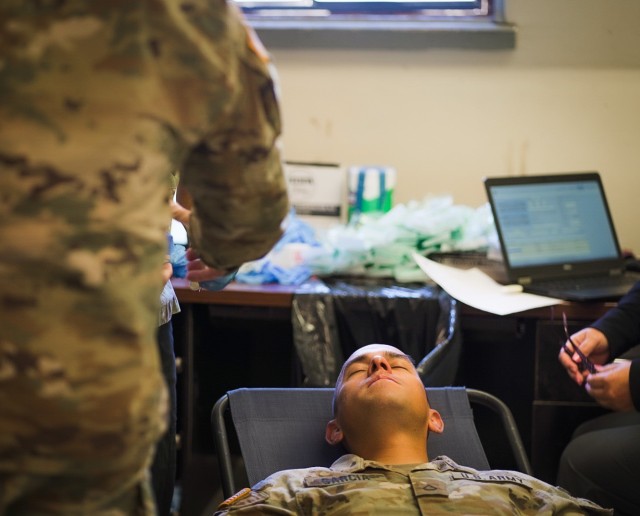 A 9th Mission Support Command (MSC) Soldier lies back for a dental exam during the rapid home mobilization rehearsal at Pohakuloa Training Area (PTA) on the Big Island of Hawaii. The rehearsal prepared Soldiers for mobilization, using Soldiers from the 3301st Mobilization Support Battalion (MSB) and other support staff, to help conduct the exercise.

Photo by Sgt. Adrianne Tuante