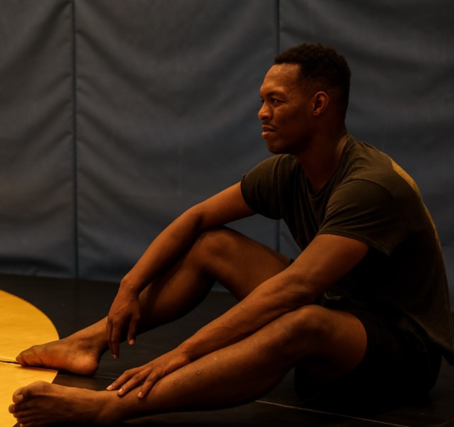 Spc. Daedrick Lashley rest in between rolling sessions during Jiu Jitsu practice.