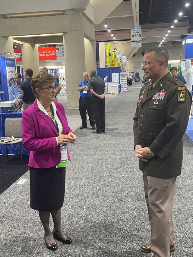 Lorraine Martin, president and CEO of the National Safety Council, and Brig. Gen. Gene Meredith, director of Army Safety and commanding general at the U.S. Army Combat Readiness Center, confer on the exhibit floor during the National Safety Council&#39;s 2022 annual Congress and Expo in San Diego, California.
