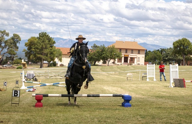 Ashley Mount and her mount, Jet, compete in the Level III Saber & Pistol competition during the B Troop, 4th U.S. Cavalry Regiment (Memorial) best trooper competition, “The Troopies,” on Sept. 10 at Brown Parade Field, Fort Huachuca, Arizona.