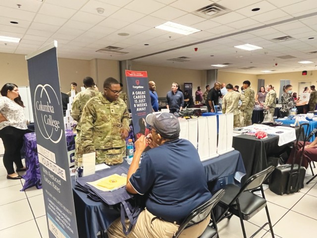 Soldier speaks with college