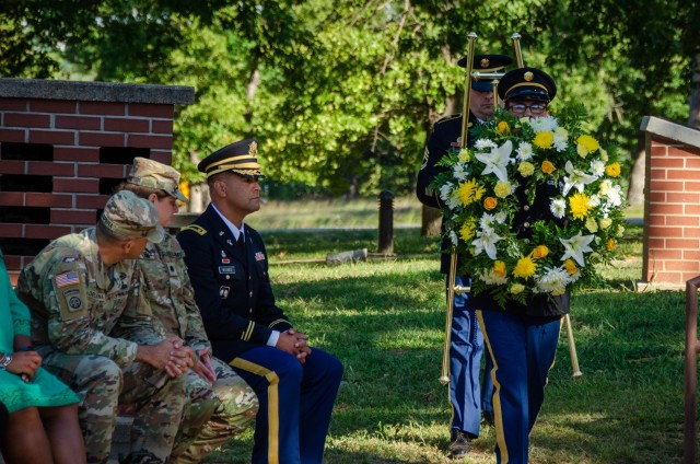 U.S. Army Military Police School Soldiers carry a wreath Sept. 19 at the MP Memorial Grove during a ceremony honoring fallen MP Soldiers.