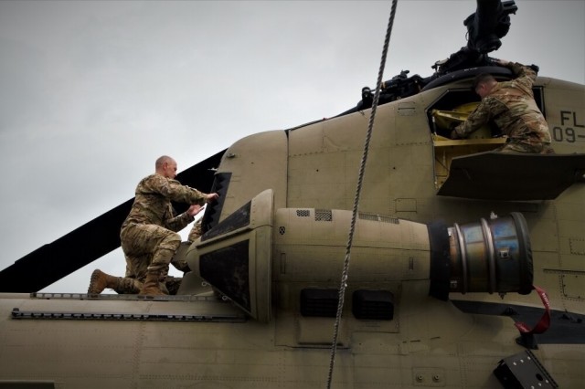 Soldiers assigned to the 1-111th General Support Aviation Battalion (GSAB) conduct daily maintenance and pre-flight inspections on a CH-47F Chinook helicopter at Opa-locka, Florida, on Sept. 28, 2022. The 1-111th GSAB, headquartered in Jacksonville, Florida, was activated to support the Florida National Guard’s response to Hurricane Ian.