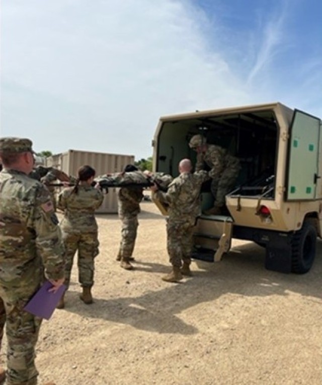 374th Hospital Center personnel unload notional patients during mass casualty training  at Fort McCoy.