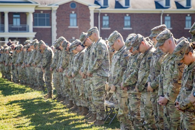 Indiana National Guard Soldiers with the 76th Infantry Brigade Combat Team pause for a moment of reflection during their departure ceremony at Camp Atterbury near Edinburgh, Indiana, Sept. 30, 2022. (Indiana National Guard photo by Sgt. Jonah Alvarez)