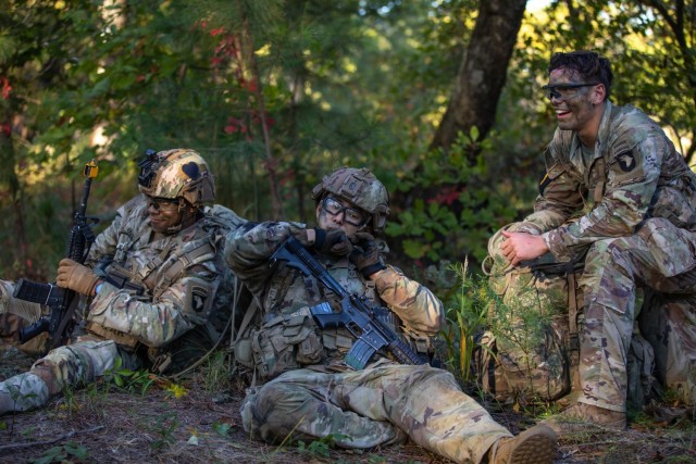Soliders of Squad 1, representing U.S. Army Forces Command, take a short rest after participating in a simulated escort mission during the Army’s first-ever Best Squad Competition on Fort Bragg, North Carolina, Oct. 3, 2022. Each squad competing in the Army Best Squad Competition consists of five Soldiers; a squad leader, which is a sergeant first class or staff sergeant; a team leader, which is a sergeant or corporal; and three squad members in the ranks of specialist or below.