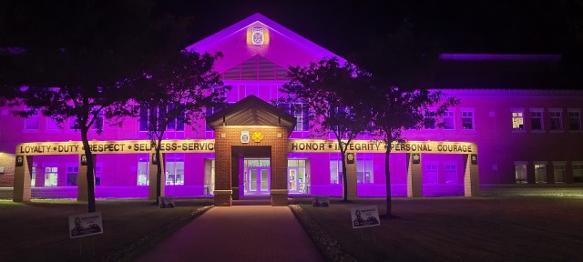 Clark Hall is awash in purple light in support of Domestic Violence Awareness Month at Fort Drum. Community members visiting the facility will also see numerous displays at the entrance and in the lobby to help “Break the Silence” and become more informed about reporting options and how they can help others experiencing domestic abuse. (Photo by Mike Strasser, Fort Drum Garrison Public Affairs)