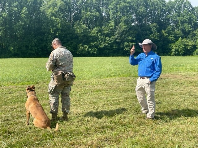 Pat Nolan instructs tactical off-leash directional handling to a young Patrol Explosive Detector Dog-Enhanced (PEDD-E) Team.
