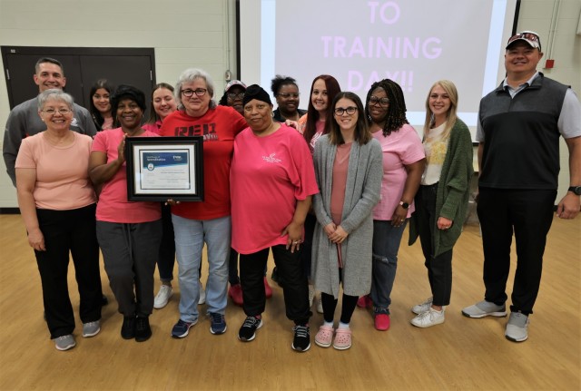 Fort Knox Garrison Commander Col. Lance O’Bryan and Command Sgt. Maj. William Fogle praise members of the Child Development Center team during the presentation of the National Association for the Education of Young Children reaccreditation...