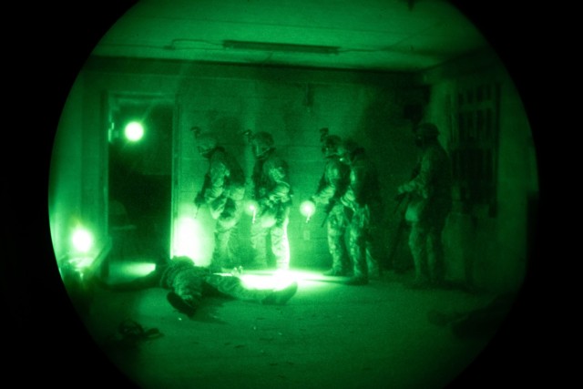 U.S. Soldiers competing in the Army’s first-ever Best Squad Competition prepare to enter a room on Fort Bragg, North Carolina, Oct. 4, 2022. Each squad competing in the Army&#39;s Best Squad Competition consists of five soldiers; a squad leader, which is a sergeant first class or staff sergeant; a team leader, which is a sergeant or corporal; and three squad members in the ranks of specialist or below.