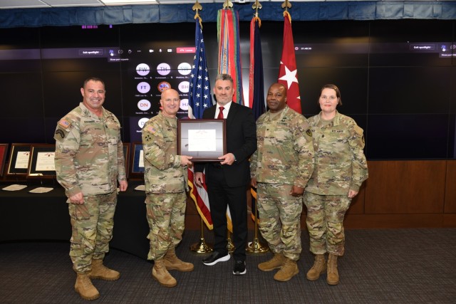 Corey Hotle receives the Army Materiel Command Louis Dellamonica Award from Gen. Ed Daly, the AMC commander, during a ceremony on Sep. 22, 2022, at Redstone Arsenal in Huntsville, Alabama. L to R Command Sgt. Maj. Jorge Escobedo, Army Sustainment...