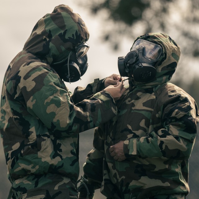 U.S. Army Soldiers with 153rd Medical Detachment (Blood Support), 56th Multifunctional Medical Battalion, 62nd Medical Brigade, don advanced chemical protective garments during an introductory course on chemical, biological, radiological and...