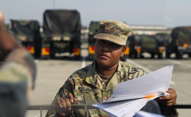 U.S. Army Staff Sgt. Desirae Williams assigned to Headquarters Company, Division Special Troops Battalion, 2nd Infantry Division Sustainment Brigade, 2nd Infantry Division/ROK-U.S. Combined Division leads vehicle inventories with her Soldiers at Camp Humphreys, Republic of Korea, Sept. 26, 2022. Williams is an 89B, Ammunitions Specialist, serving as the land and ammo noncommissioned officer for DSTB. (U.S. Army photo by Sgt. Evan Cooper)