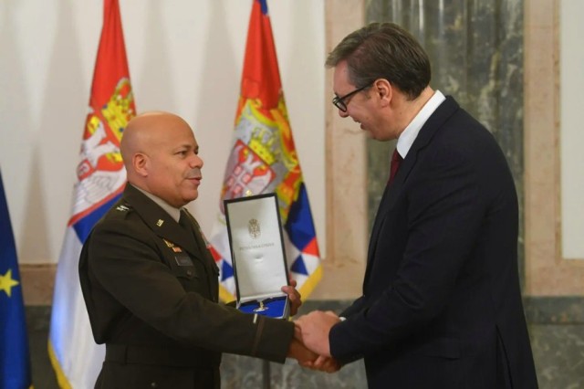 Serbian President Aleksandar Vučić, right, awards the Order of the Serbian Flag (2nd Class) to Maj. Gen. John C. Harris Jr., Ohio adjutant general, during a ceremony in the presidency building Sept. 8, 2022, in Belgrade, Serbia. The Ohio National Guard and Serbia Armed Forces have been partners under the Department of Defense National Guard Bureau State Partnership Program for 16 years. (Courtesy photo)

