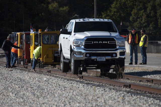 DJ Keeney, a civil engineer technician with Fort Leonard Wood’s Directorate of Public Works (right), speaks with a member of the First Iowa Division of the North American Railcar Operators Association during their visit Saturday for a ride on...