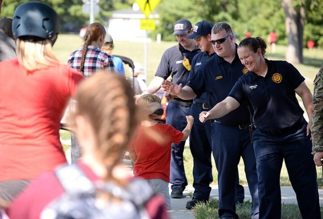 Fist Bump Fridays: Emergency responders greet students after school each month
