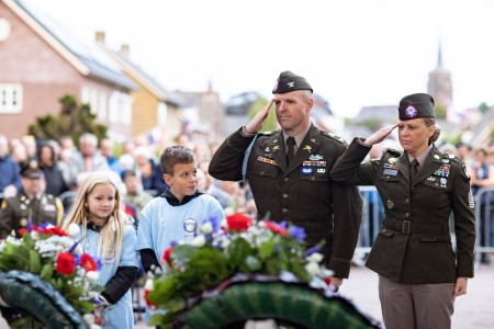 Officers assigned to the 101st Airborne Division (Air Assault) salute wreaths honoring World War II veterans during the official ceremony for the 78th commemoration of Operation Market Garden at Eerde, Netherlands, Sept. 17, 2022.