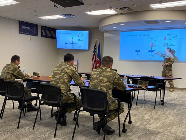 Cybersecurity officers from the Azerbaijan army listen to a presentation by an Oklahoma Air National Guard member during a cybersecurity knowledge exchange hosted by the Oklahoma National Guard at the Will Rogers Air National Guard Base in Oklahoma City. The Oklahoma National Guard hosted a multiday exchange focused on building cooperation between the two partners. (Photo provided by Lt. Col. Sharon McCarty)