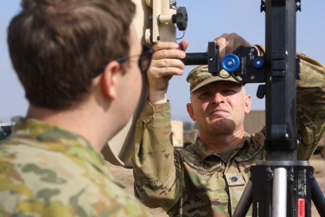 U.S. Soldier Spc. Edward Zorc trains Australian Forces on new equipment.