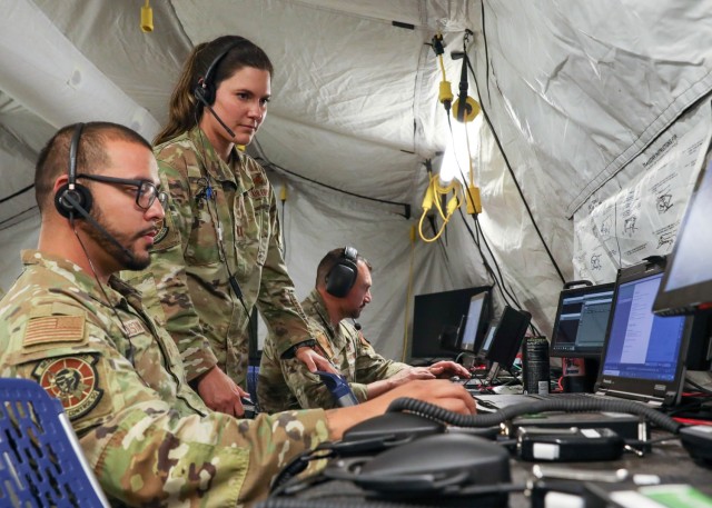 Service members conduct warfare operations at the Technical Operations Center — Light. 