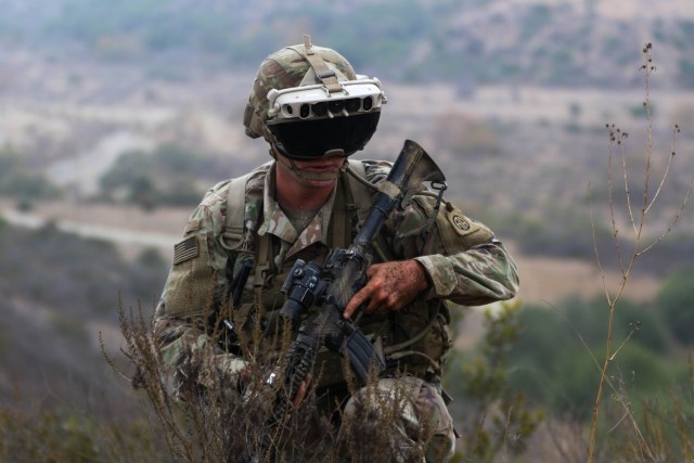 A U.S. Army Soldier assigned to 82nd Airborne Division navigates up a hill during PC22.