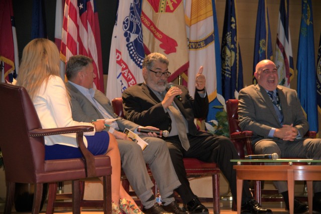 David Jimenez, vice president for research, development, test and evaluation for Jacobs Technologies and retired SES from U.S. Army Test & Evaluation Command, gives a thumbs up during a discussion panel at the Hispanic Heritage Month celebration at the Myer Auditorium Oct. 11, 2022. 